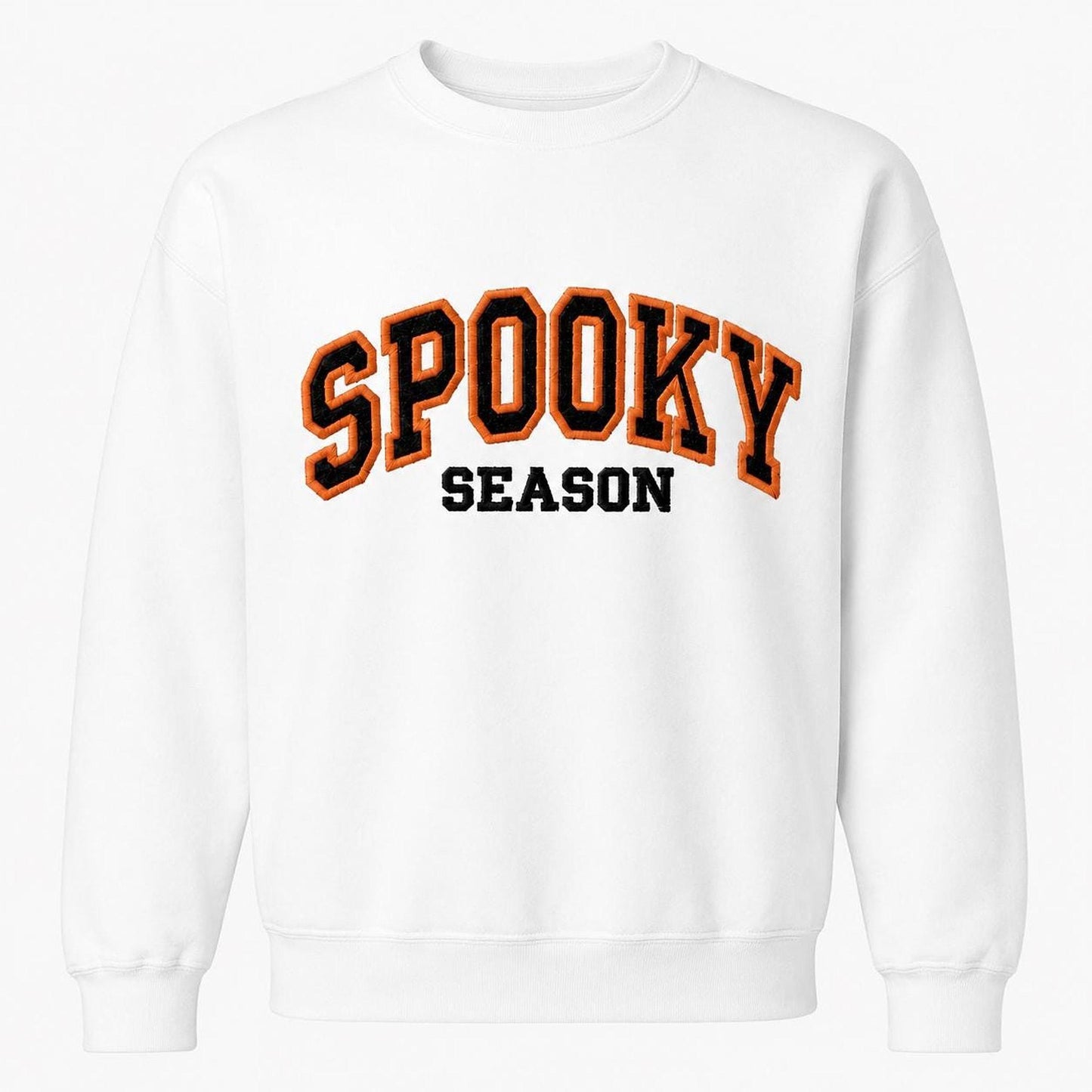 A white crewneck sweatshirt with "SPOOKY SEASON" embroidered across the chest in orange and black varsity-style letters.