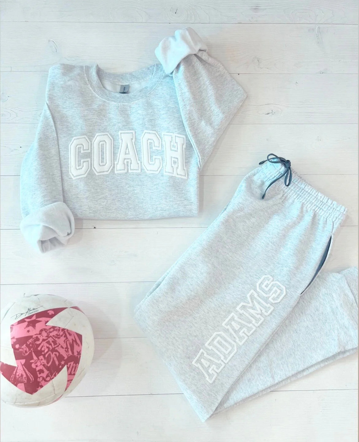 Custom Embossed Sweat Suit for Cheer Coach