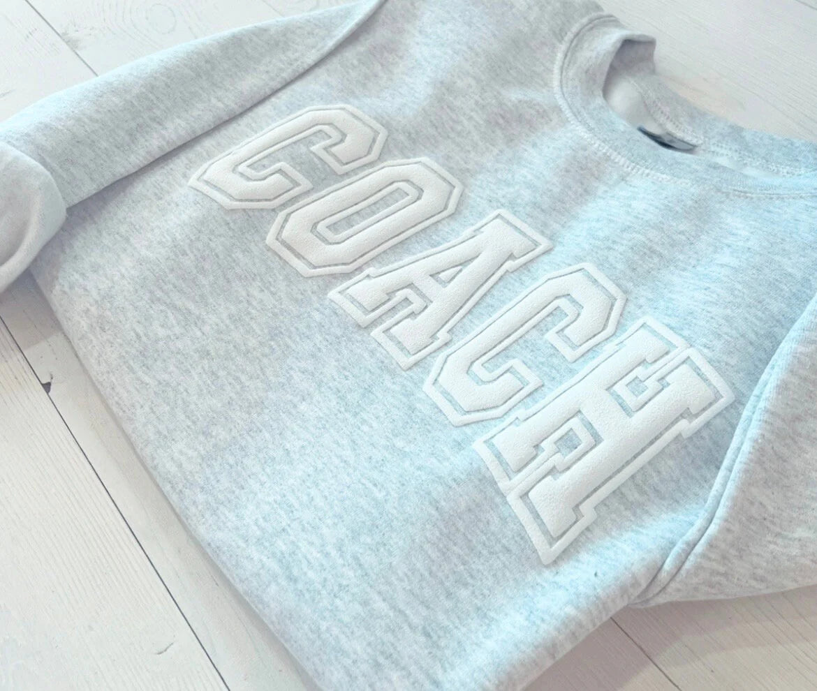 Custom Embossed Sweat Suit for Cheer Coach