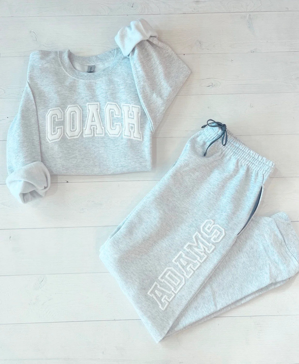 Custom Embossed Sweat Suit for Cheer Coach