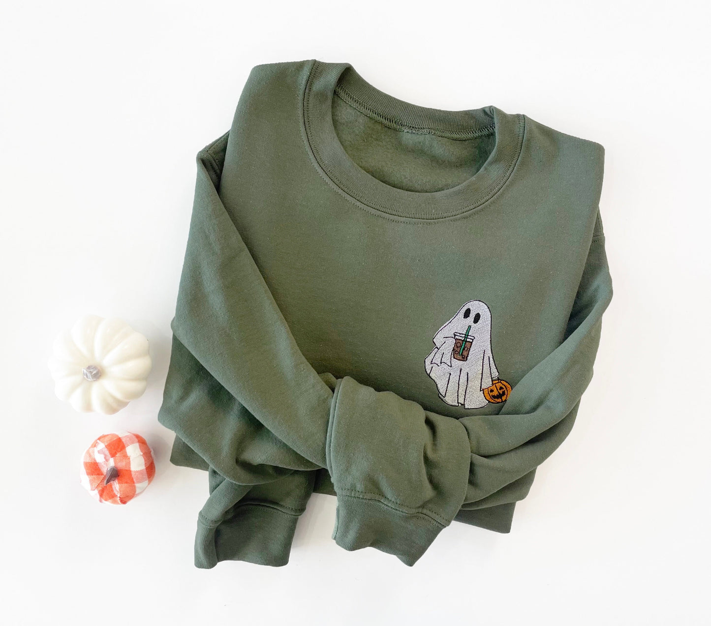 Embroidered ghost on a green sweatshirt