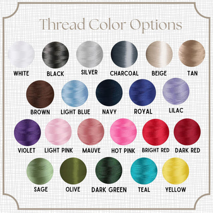 A grid of 20 thread color options for embroidery, including white, black, silver, charcoal, beige, tan, brown, light blue, navy, royal, lilac, violet, light pink, mauve, hot pink, bright red, dark red, sage, olive, dark green, teal, and yellow.