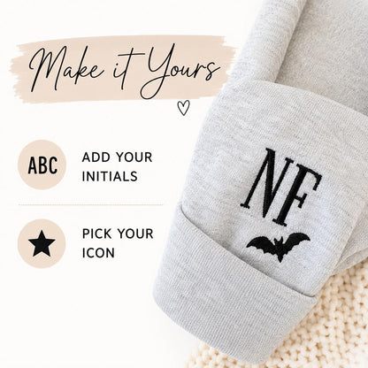 A graphic titled "Make it Yours" showing options to "Add Your Initials" and "Pick Your Icon" with an example of "NF" and a bat embroidered on a cuff.