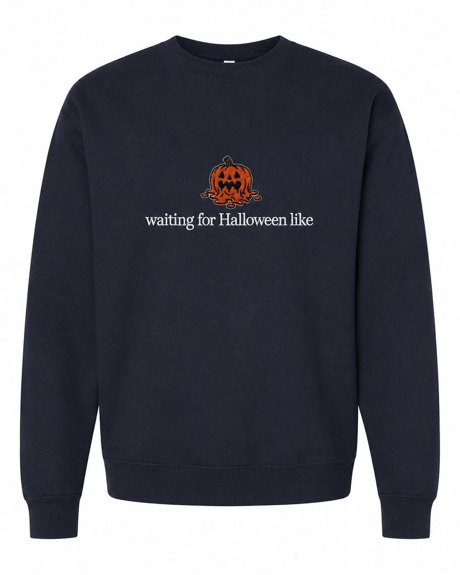 A navy blue crewneck sweatshirt with a melted orange jack-o'-lantern and the text "waiting for Halloween like" printed on the front.