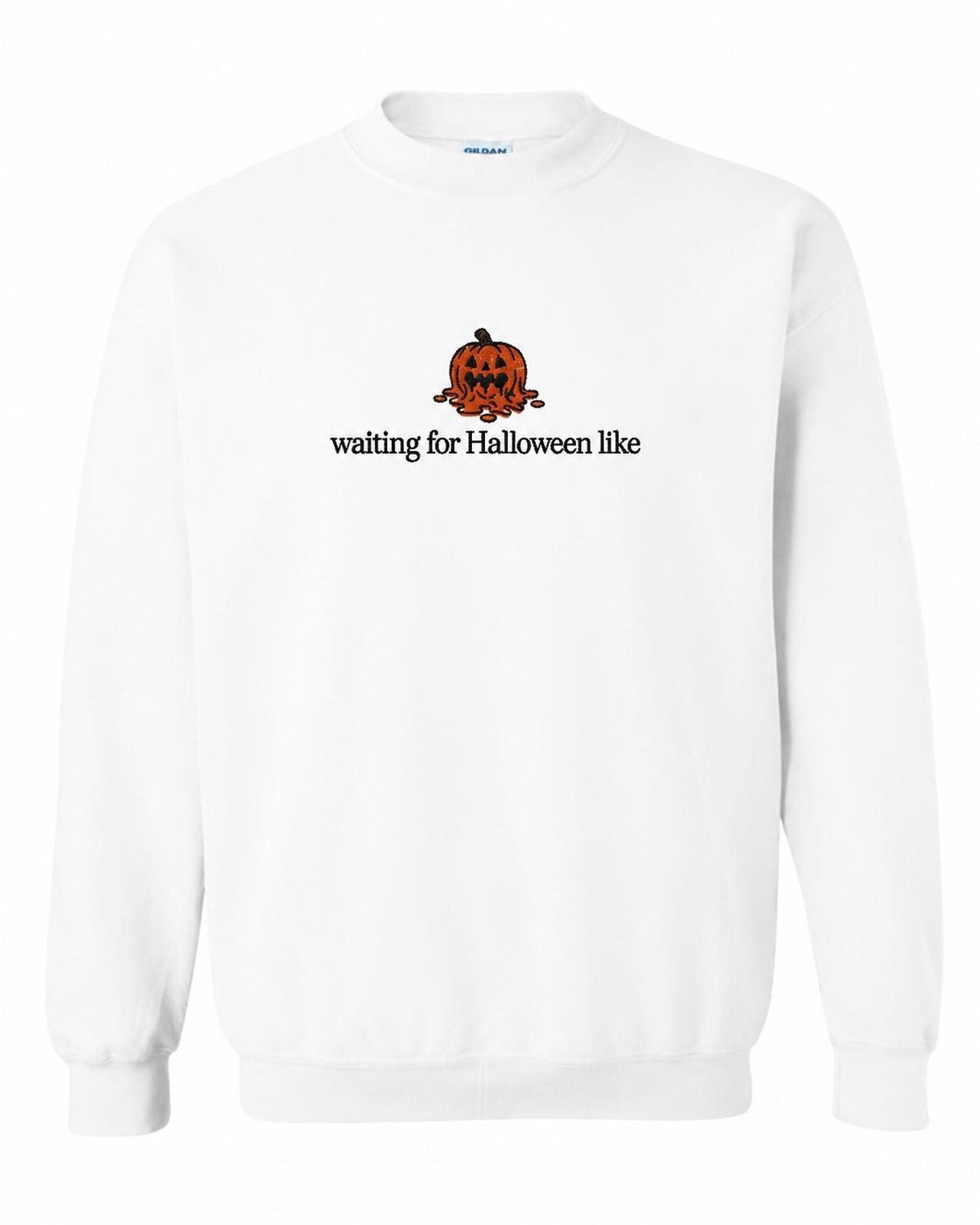 A white crewneck sweatshirt with a melted orange jack-o'-lantern and the text "waiting for Halloween like" printed on the front.
