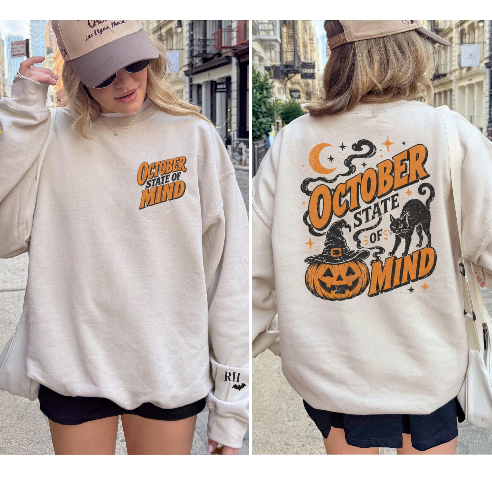A woman models a light beige crewneck sweatshirt with "October State of Mind" in orange and black text on the front and back, featuring a jack-o'-lantern and black cat on the back.