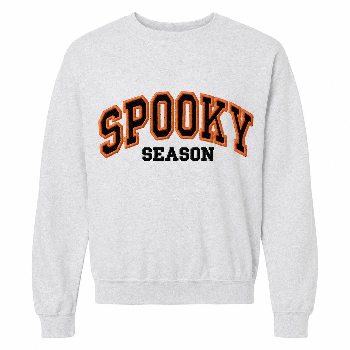 A light gray crewneck sweatshirt with "SPOOKY SEASON" embroidered across the chest in orange and black varsity-style letters.
