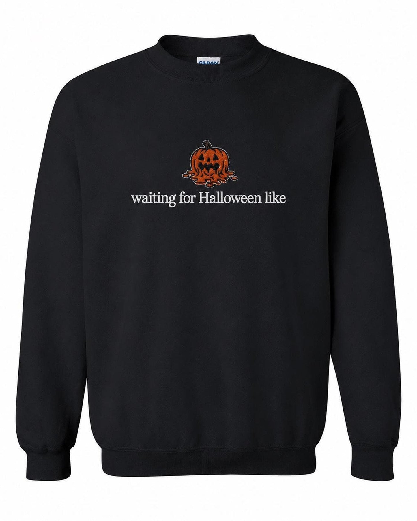 A black crewneck sweatshirt with a melted orange jack-o'-lantern and the text "waiting for Halloween like" printed on the front.