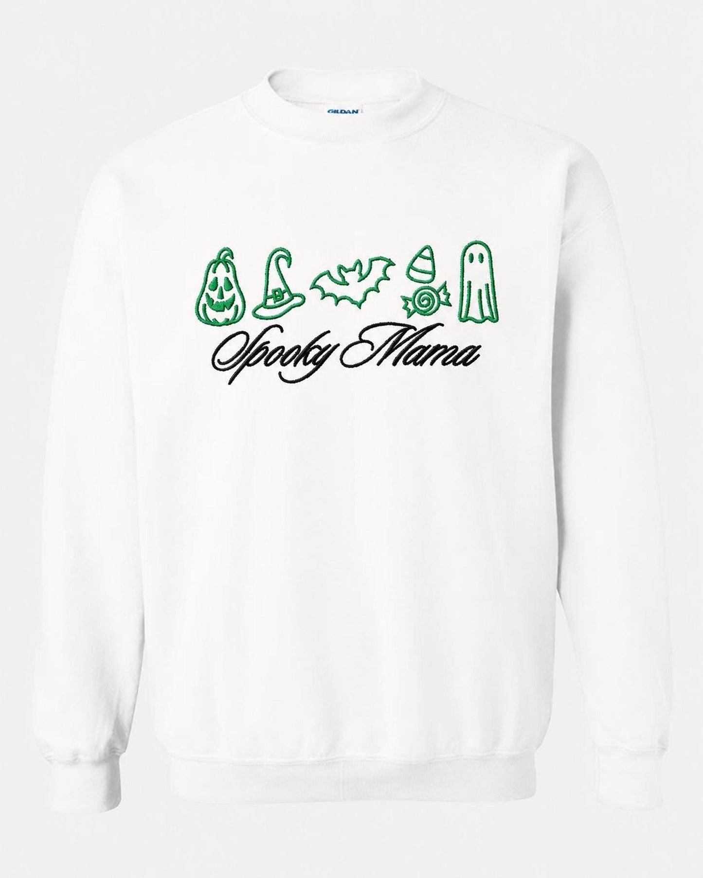 A white crewneck sweatshirt with green embroidered Halloween icons and "Spooky Mama" in black script, displayed flat against a white background.