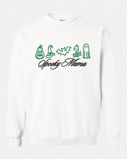 A white crewneck sweatshirt with green embroidered Halloween icons and "Spooky Mama" in black script, displayed flat against a white background.