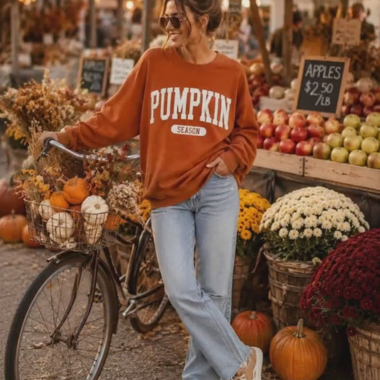 video of woman during halloween driving around pumpkin patch with pumpkin season festive sweatshirt on