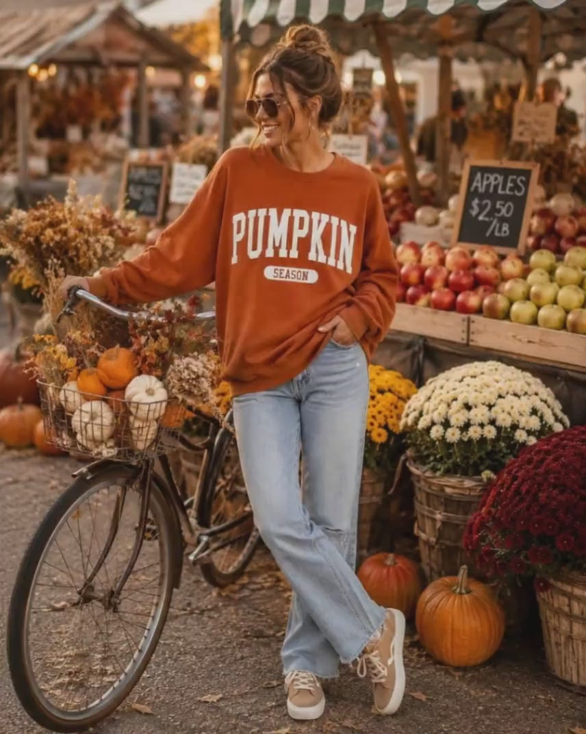 video of woman during halloween driving around pumpkin patch with pumpkin season festive sweatshirt on